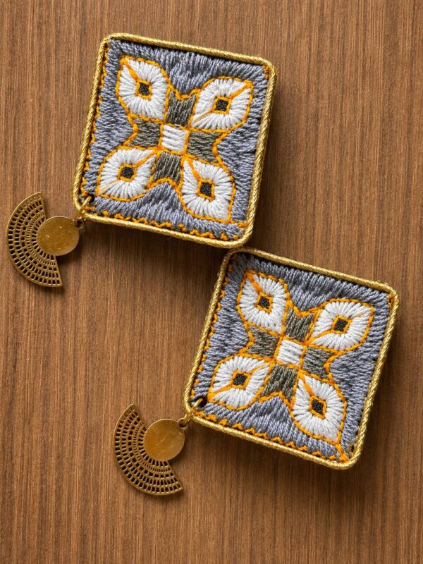 Grey and white geometric embroidered earrings with gold-tone fan-shaped drops