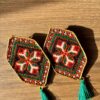 Red and green floral embroidered earrings with red tassels