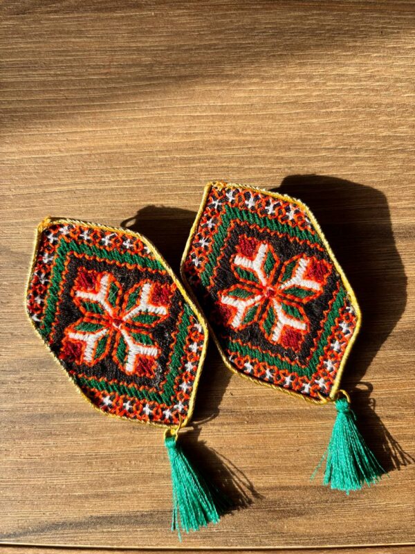 Red and green floral embroidered earrings with red tassels