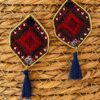 Red and navy diamond-shaped embroidered earrings with navy tassels