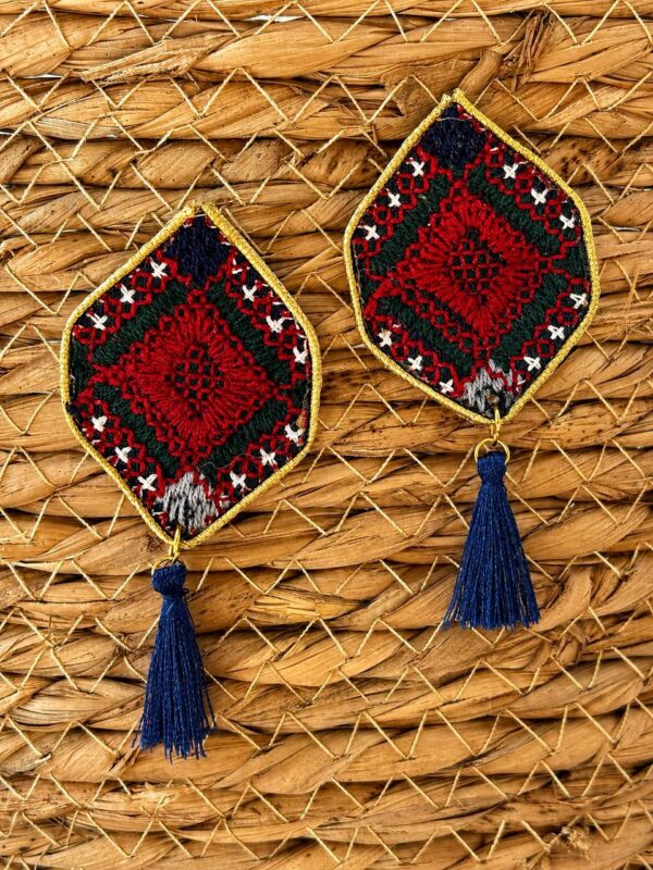 Red and navy diamond-shaped embroidered earrings with navy tassels