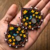 Navy embroidered earrings with yellow flowers blue bird motifs and white bead edging